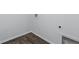 The laundry room has plenty of room for laundry needs and wood look flooring at 4353 Pond Edge Rd, Snellville, GA 30039