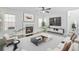 Inviting living room with a fireplace, comfortable seating, and abundant natural light, creating a cozy ambiance at 4353 Pond Edge Rd, Snellville, GA 30039