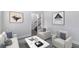 Elegant living room with stylish furniture, modern art, and soft natural light, creating a welcoming atmosphere at 4353 Pond Edge Rd, Snellville, GA 30039