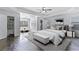 Large main bedroom with hardwood floors, seating area, and natural light at 4353 Pond Edge Rd, Snellville, GA 30039