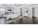 Spacious main bedroom with a tray ceiling, hardwood floors, and natural light at 4353 Pond Edge Rd, Snellville, GA 30039