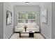 Bright sitting area showcases large windows, neutral paint, contemporary furnishings, and lots of natural light at 4353 Pond Edge Rd, Snellville, GA 30039