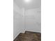 Walk-in closet featuring hardwood floors, white walls, and wire shelving at 4353 Pond Edge Rd, Snellville, GA 30039