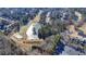 Overhead shot showcases a community pond and golf course lined with homes in a tranquil, wooded setting at 5702 Brynwood Nw Cir, Acworth, GA 30101