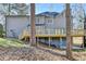 Backyard view featuring a wooden deck with stairs at 5702 Brynwood Nw Cir, Acworth, GA 30101