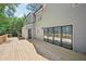 Large deck with backyard views featuring bi-fold doors to merge indoor-outdoor living at 5702 Brynwood Nw Cir, Acworth, GA 30101