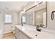 Modern bathroom with double sinks, quartz counters, and stylish fixtures at 5702 Brynwood Nw Cir, Acworth, GA 30101