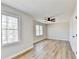 Bedroom with plenty of sunlight, new floors and ceiling fan at 5702 Brynwood Nw Cir, Acworth, GA 30101