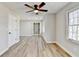 Large bedroom with plank flooring, ceiling fan, closet and natural light at 5702 Brynwood Nw Cir, Acworth, GA 30101