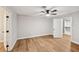 Bright bedroom features modern flooring, a ceiling fan, and a walk-in closet at 5702 Brynwood Nw Cir, Acworth, GA 30101