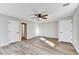 Spacious bedroom features new floors, ceiling fan, neutral paint and bright sunlight at 5702 Brynwood Nw Cir, Acworth, GA 30101