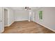 Spacious bedroom with hardwood floors, neutral walls, ceiling fan, and natural light from the window at 5702 Brynwood Nw Cir, Acworth, GA 30101