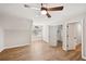 Bedroom with hardwood flooring, modern ceiling fan, and bright windows, door to the closet and bathroom at 5702 Brynwood Nw Cir, Acworth, GA 30101