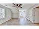 Spacious bonus room featuring hardwood floors, a large window, and natural light at 5702 Brynwood Nw Cir, Acworth, GA 30101