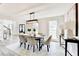 Formal dining room with views to the foyer, living room and an abundance of natural light at 5702 Brynwood Nw Cir, Acworth, GA 30101