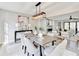 Bright dining room featuring a modern light fixture and views into the living room at 5702 Brynwood Nw Cir, Acworth, GA 30101