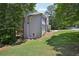 Charming gray two-story home with lush green landscaping and a beautiful outdoor deck at 5702 Brynwood Nw Cir, Acworth, GA 30101