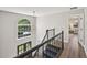 Bright foyer featuring a modern chandelier and a large arched window at 5702 Brynwood Nw Cir, Acworth, GA 30101