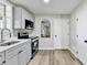 Modern kitchen with grey cabinets, new appliances, and a stylish sink at 5702 Brynwood Nw Cir, Acworth, GA 30101