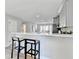 Kitchen with white quartz bar and stylish seating, perfect for casual dining and entertaining at 5702 Brynwood Nw Cir, Acworth, GA 30101