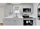 Kitchen with new appliances and light gray cabinets at 5702 Brynwood Nw Cir, Acworth, GA 30101