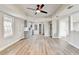 Open-concept living area with new flooring, kitchen, and lots of light at 5702 Brynwood Nw Cir, Acworth, GA 30101