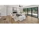 Inviting living area with hardwood floors, fireplace, neutral furniture, and sliding doors to the outdoor deck at 5702 Brynwood Nw Cir, Acworth, GA 30101