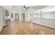 Spacious room features modern flooring, neutral paint, a ceiling fan, and an attached kitchenette at 5702 Brynwood Nw Cir, Acworth, GA 30101