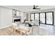 Modern living room with white furniture, fireplace, and natural light at 5702 Brynwood Nw Cir, Acworth, GA 30101