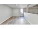 Living room with laminate flooring and a window at 5702 Brynwood Nw Cir, Acworth, GA 30101