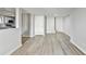 Spacious living area with plank flooring leading to kitchen at 5702 Brynwood Nw Cir, Acworth, GA 30101