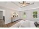 Inviting main bedroom featuring a tray ceiling and multiple windows with neighborhood views at 5702 Brynwood Nw Cir, Acworth, GA 30101
