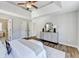 Main bedroom features a decorative dresser, a sitting bench, and access to a walk-in closet and ensuite bathroom at 5702 Brynwood Nw Cir, Acworth, GA 30101