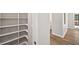 Walk-in pantry with custom shelving for organized storage and easy access at 5702 Brynwood Nw Cir, Acworth, GA 30101