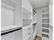Walk-in closet with custom shelving and drawers, providing ample storage and organization at 5702 Brynwood Nw Cir, Acworth, GA 30101