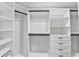 Walk-in closet with custom shelving and drawers, offering ample storage and organization at 5702 Brynwood Nw Cir, Acworth, GA 30101