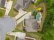Aerial view of a home with a backyard pool, patio with outdoor seating and lush landscaping in a peaceful setting at 7045 Parrish Way, Cumming, GA 30040