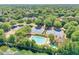 Aerial view of neighborhood amenities including tennis courts and swimming pool at 7045 Parrish Way, Cumming, GA 30040
