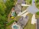 Aerial view of luxury homes with backyard pools, landscaped gardens, and expansive driveways in a serene neighborhood setting at 7045 Parrish Way, Cumming, GA 30040