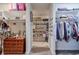 Walk-in closet with built-in shelving, shoe racks, and ample storage space at 7045 Parrish Way, Cumming, GA 30040