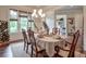 Dining room with a large window, hardwood floors, and rustic decor at 7045 Parrish Way, Cumming, GA 30040