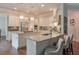 Spacious kitchen featuring granite countertops, stainless steel appliances, and modern lighting at 7045 Parrish Way, Cumming, GA 30040