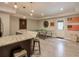 Open living space with a kitchenette area, a dart board, and a ping pong table at 7045 Parrish Way, Cumming, GA 30040
