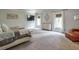 Spacious main bedroom features neutral colors, two large windows, and a cozy armchair at 7045 Parrish Way, Cumming, GA 30040