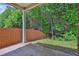 Covered back porch is perfect for outdoor dining and entertaining at 735 Scenic Creek Dr, Lawrenceville, GA 30046