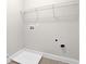 Bright laundry room features ample shelving and connections for washer/dryer at 735 Scenic Creek Dr, Lawrenceville, GA 30046