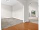 Spacious living room featuring neutral carpet, large archways and light walls at 735 Scenic Creek Dr, Lawrenceville, GA 30046