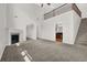 Open living room with high ceilings, fireplace, and staircase at 735 Scenic Creek Dr, Lawrenceville, GA 30046