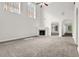 Bright living room with a fireplace, large windows, and a ceiling fan at 735 Scenic Creek Dr, Lawrenceville, GA 30046