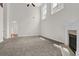 Bright living room with high ceilings, a fireplace, and large windows at 735 Scenic Creek Dr, Lawrenceville, GA 30046